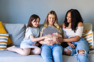 Surrogate and intended family sharing a moment during the surrogacy journey process