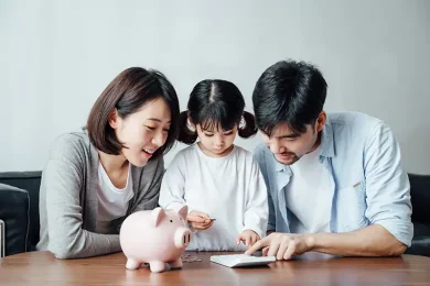 Family reviewing finances and saving money together for future planning and surrogacy costs